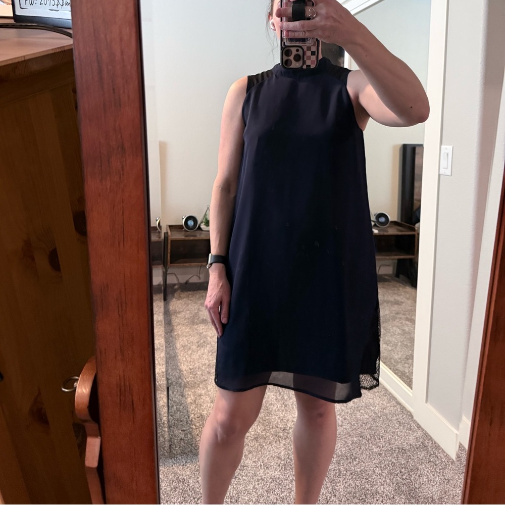 Chic Navy dress with black mesh details. Size M